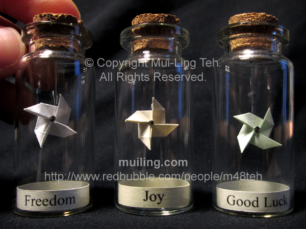 Miniature origami pinwheels in bottles. Plain ones are available in white, yellow or green.