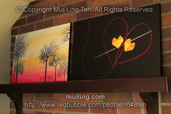 Mounted prints of "Sunset with Blue Trees" and "Red String of Fate" by Mui-Ling Teh