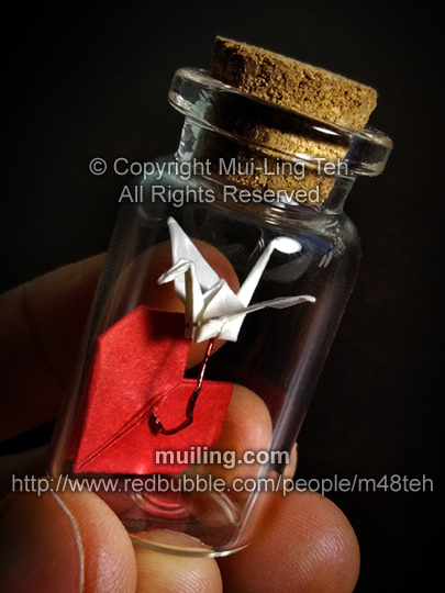 origami crane and heart in a small bottle by Mui-Ling Teh
