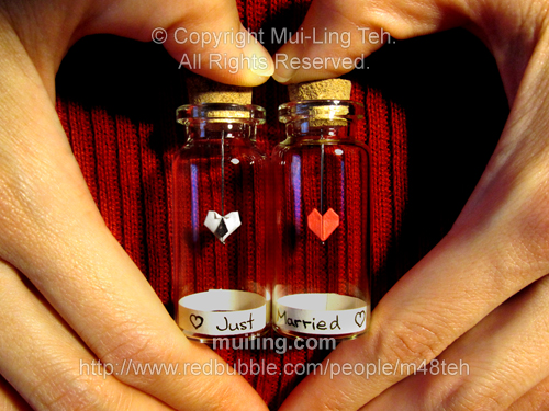 Miniature origami neck-tie heart and red heart in bottles with labels "Just Married"