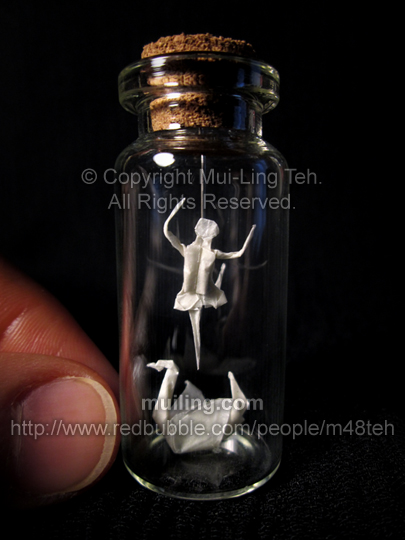 Miniature origami ballerina and white swan in a bottle; inspired by the ballet Swan Lake