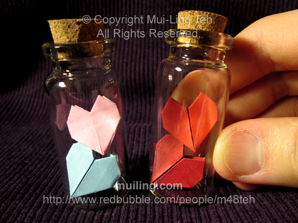 Two stacked origami hearts in bottles by Mui-Ling Teh